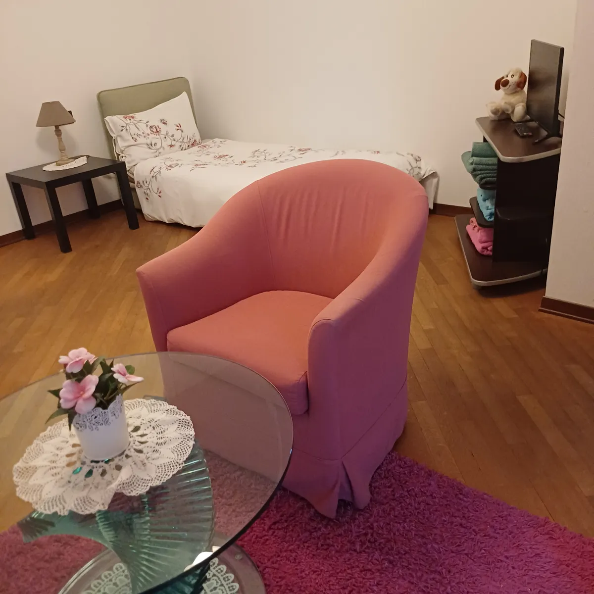 The armchair and coffee table in the sitting room, in Suite Principessa